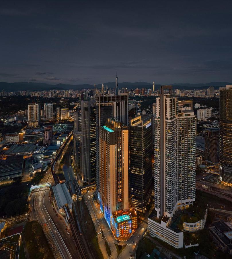 Amari Kuala Lumpur Hotel Exterior photo Aerial view of the complex at night